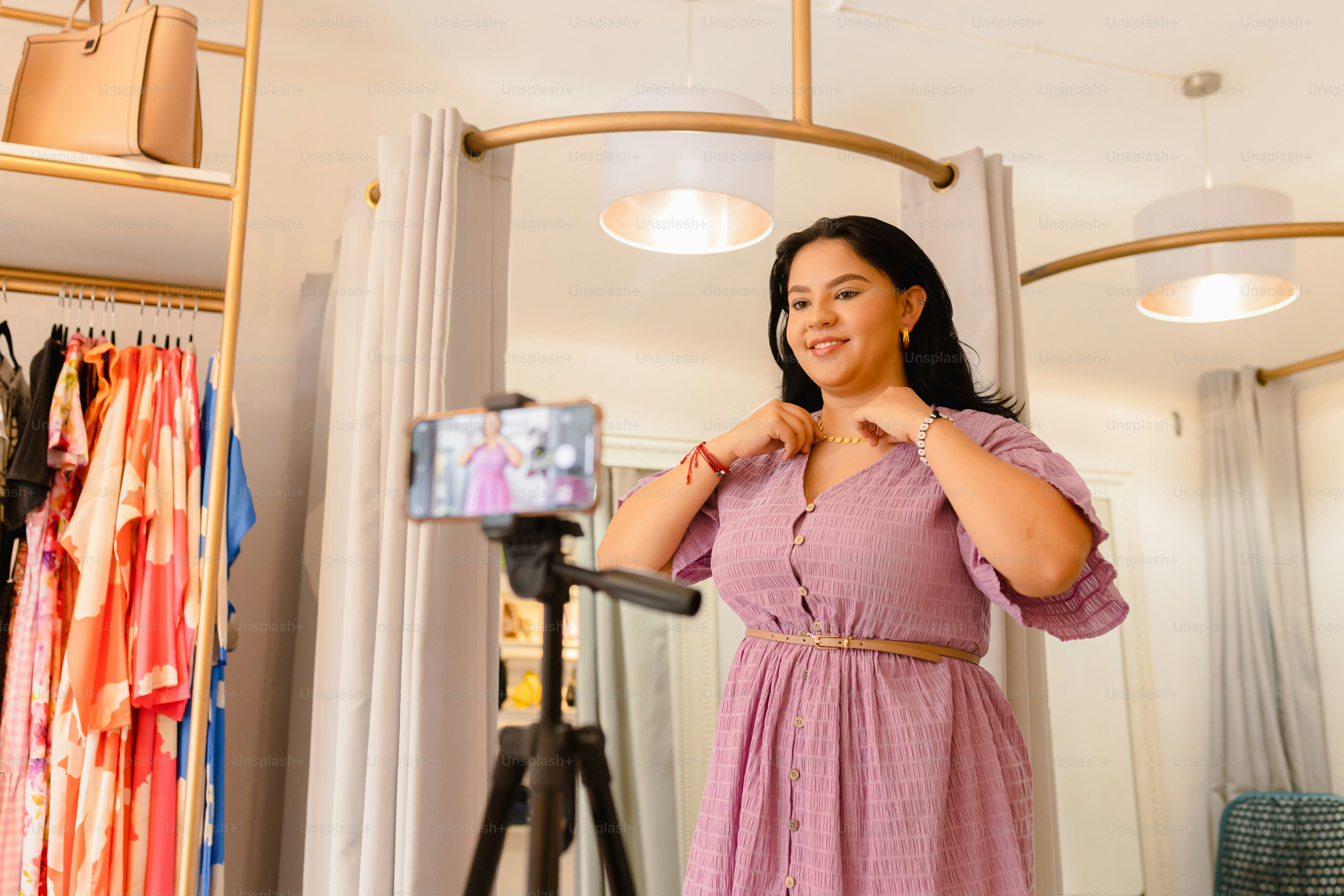 a woman taking a picture of herself in a mirror
