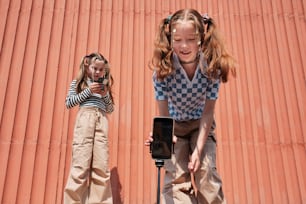 two little girls standing next to each other