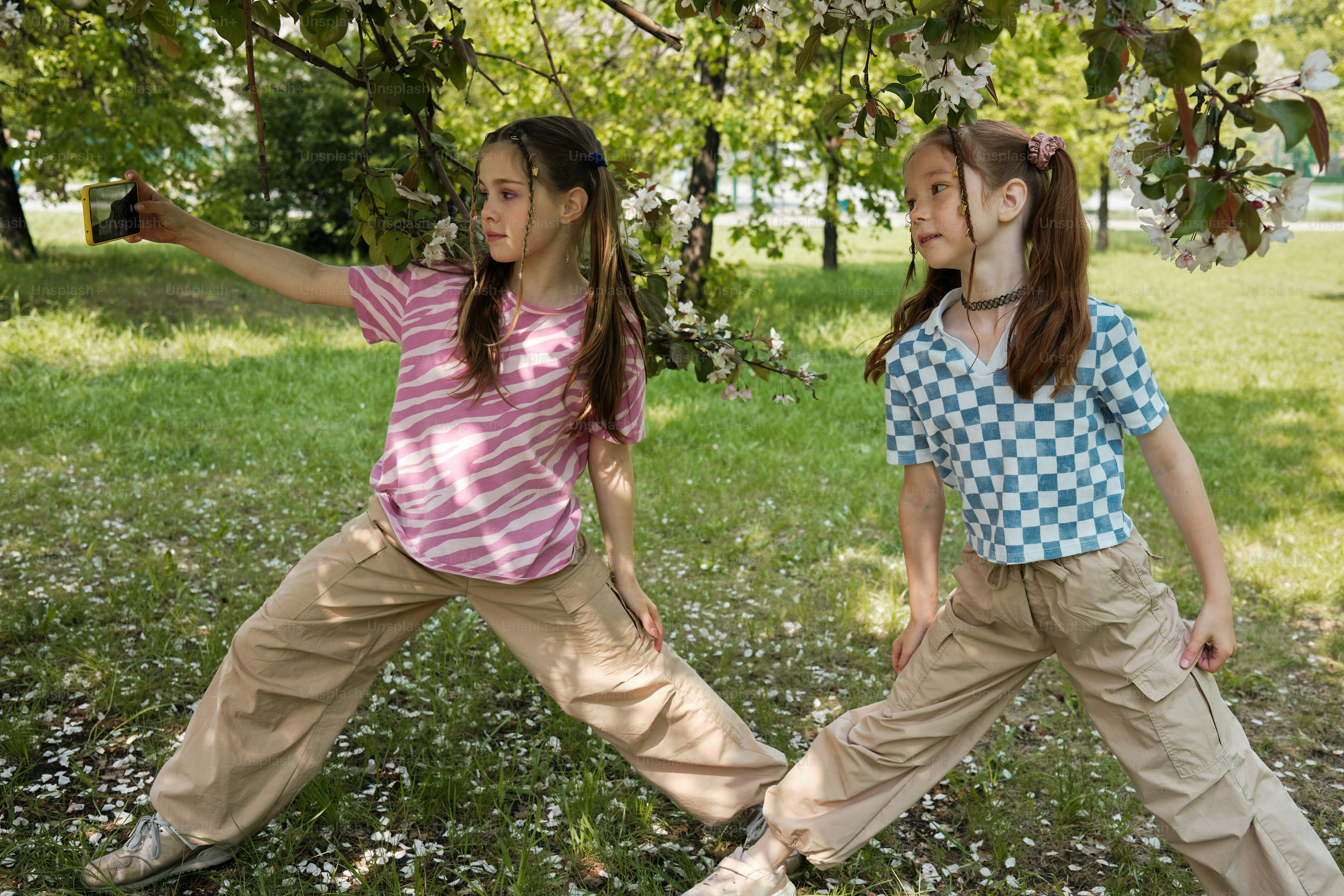 two young girls making content on their phone