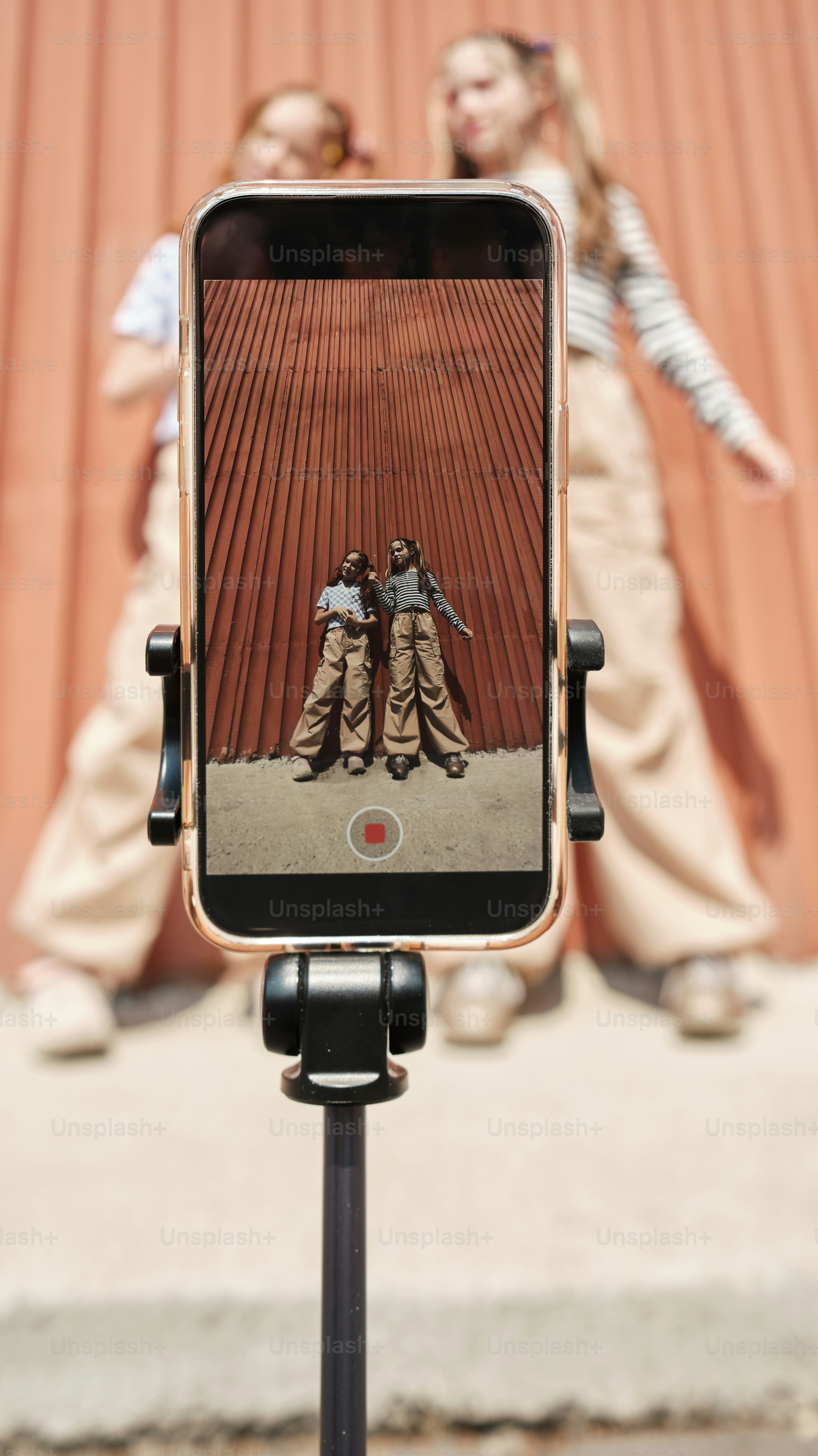 two young girls dancing in front of a camera