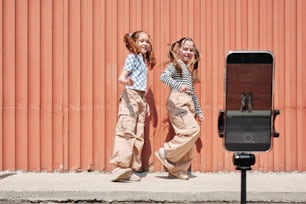 a couple of girls standing next to each other