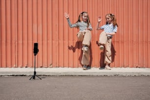 a couple of girls standing next to each other