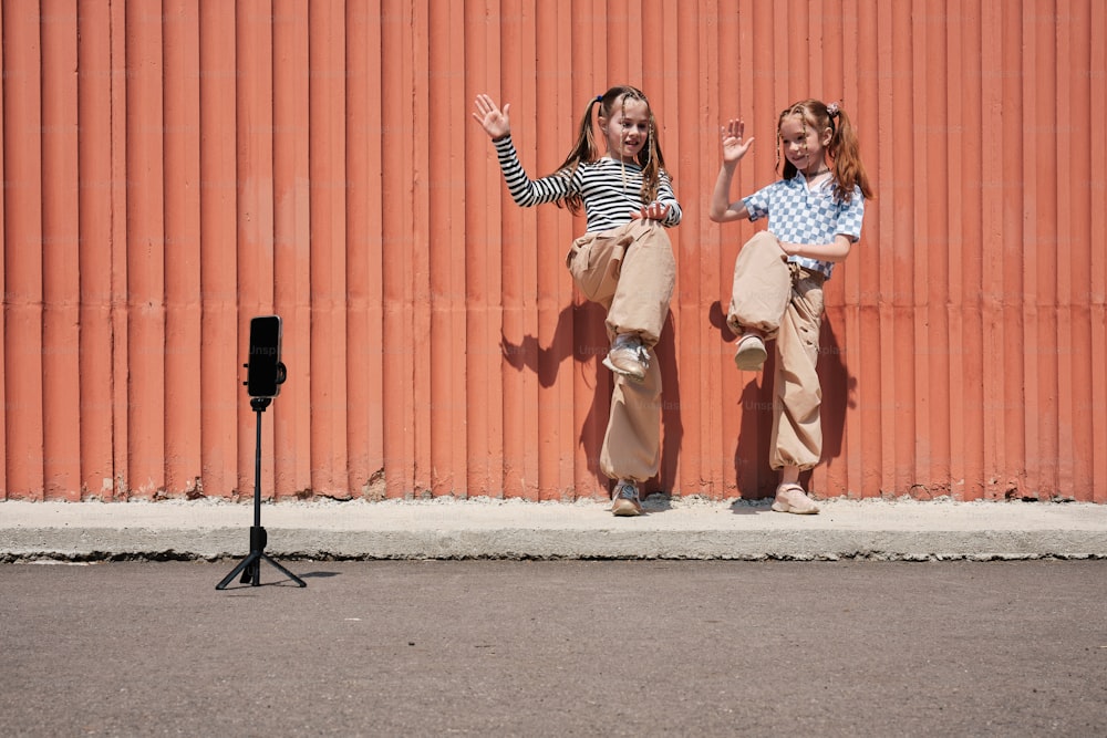 a couple of girls standing next to each other