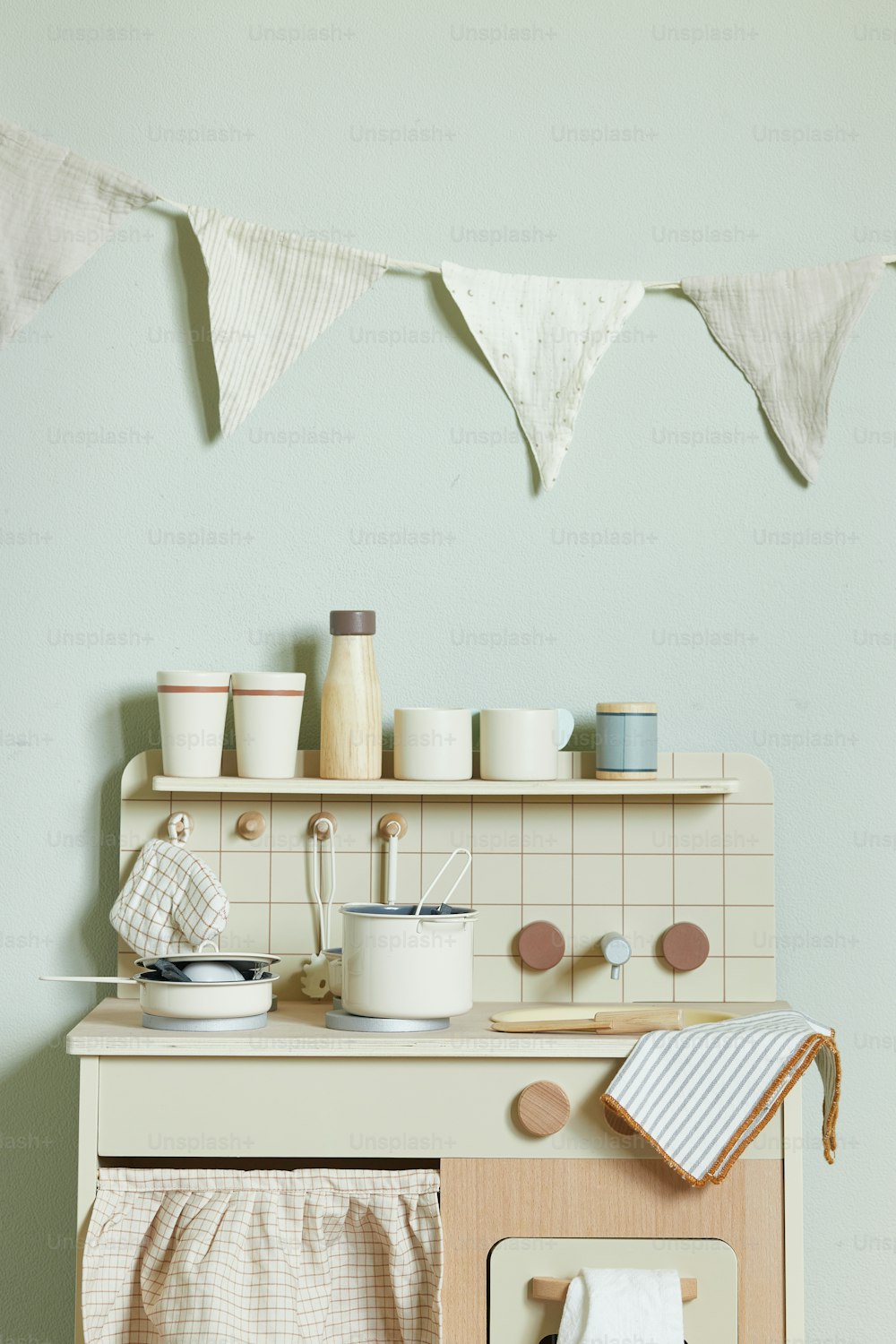 a kitchen with a stove top oven sitting next to a wall