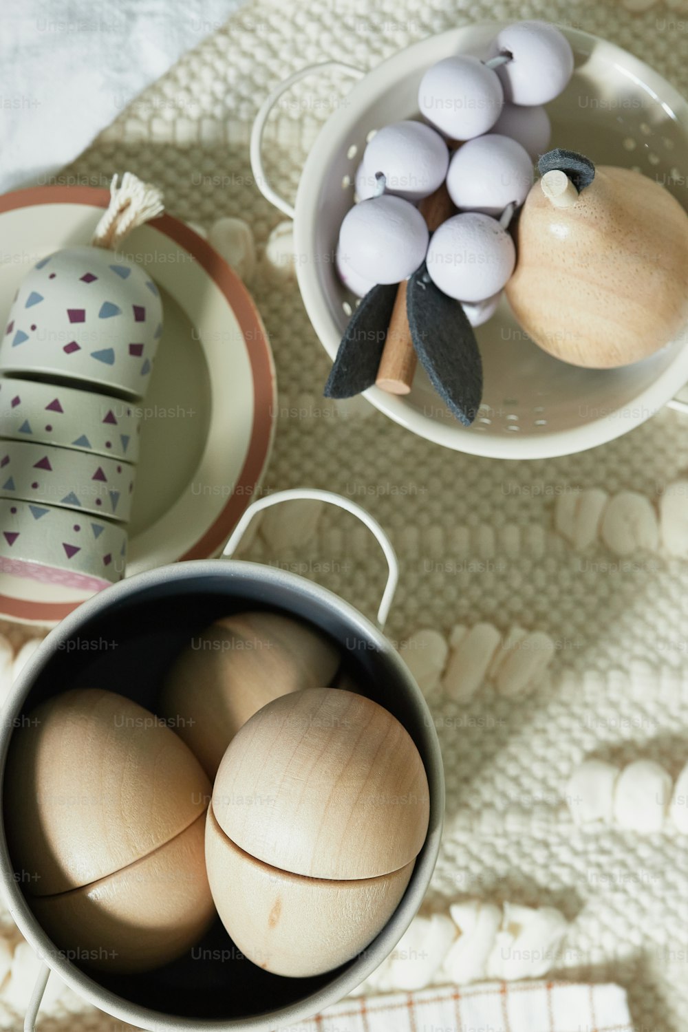 a table topped with plates and bowls filled with eggs
