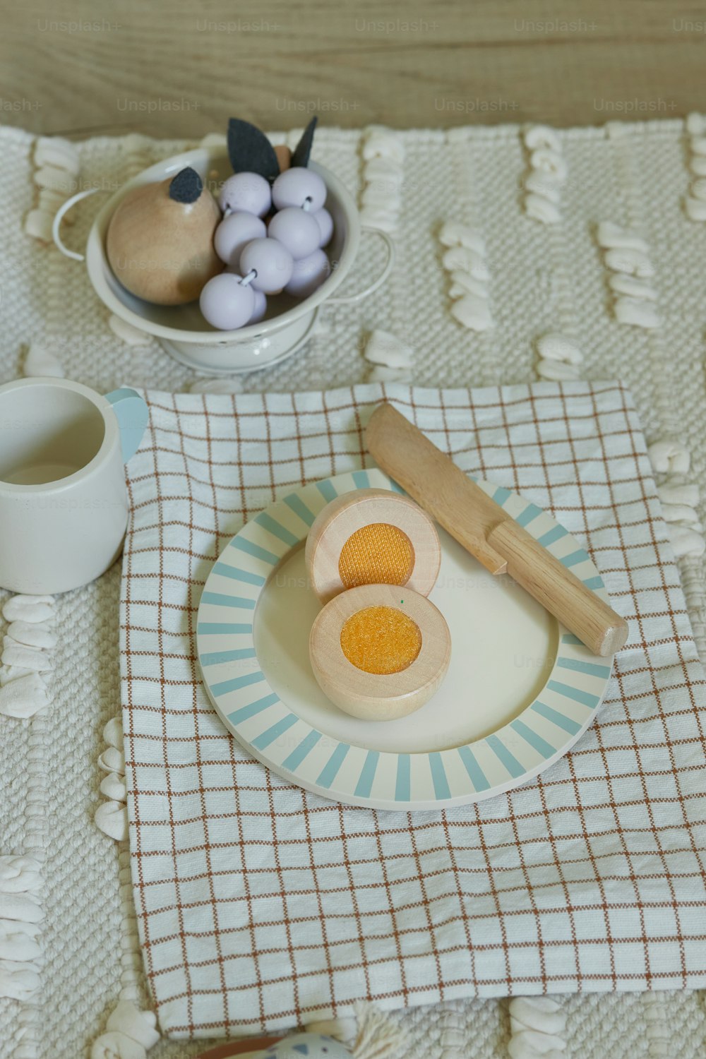 a table with a plate of food and a cup of coffee