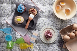 a table topped with bowls and plates filled with food