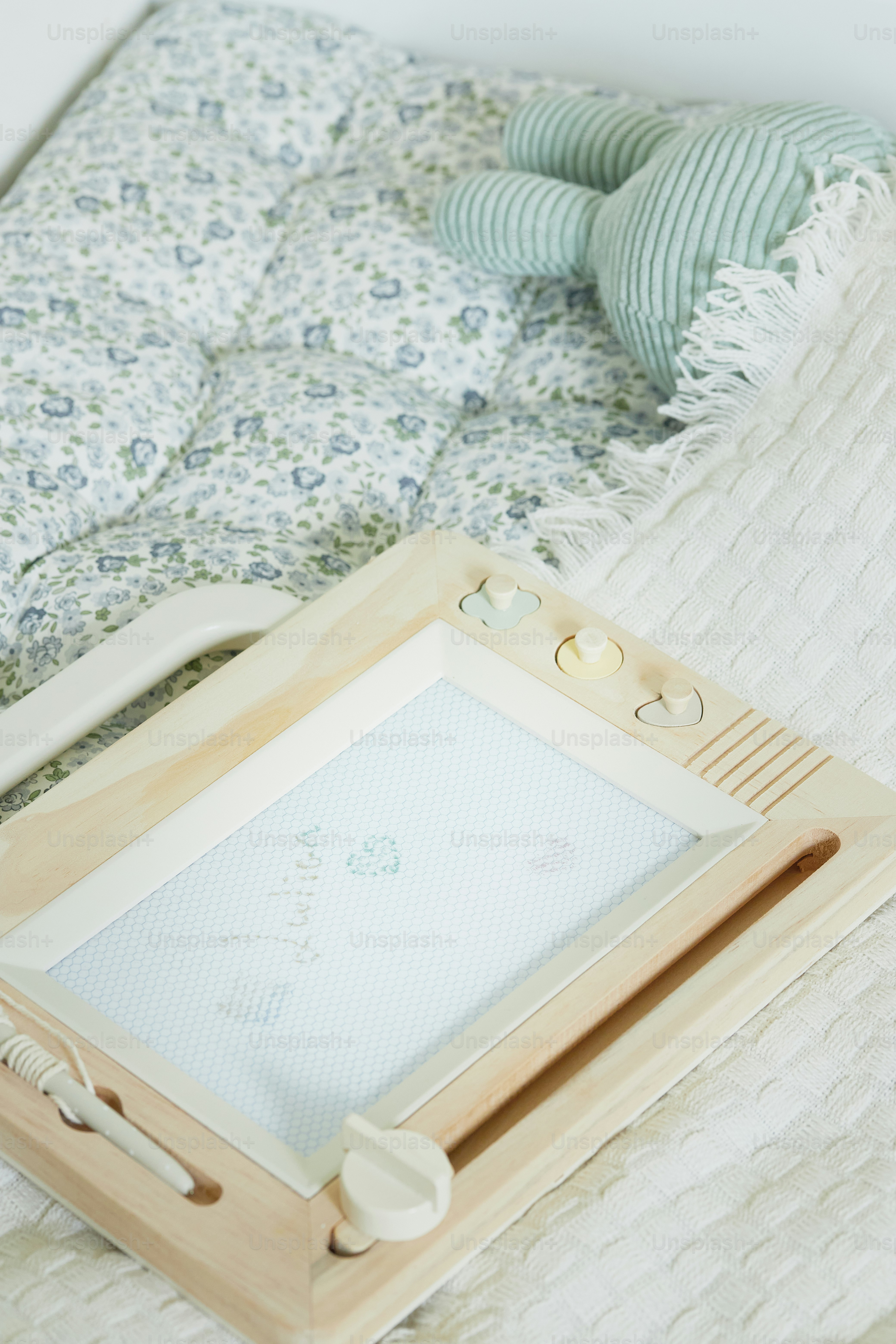 a picture frame sitting on top of a bed