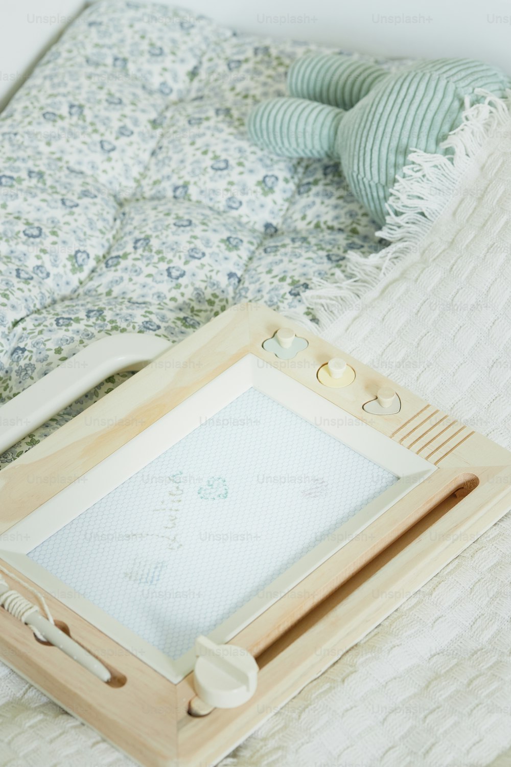 a picture frame sitting on top of a bed
