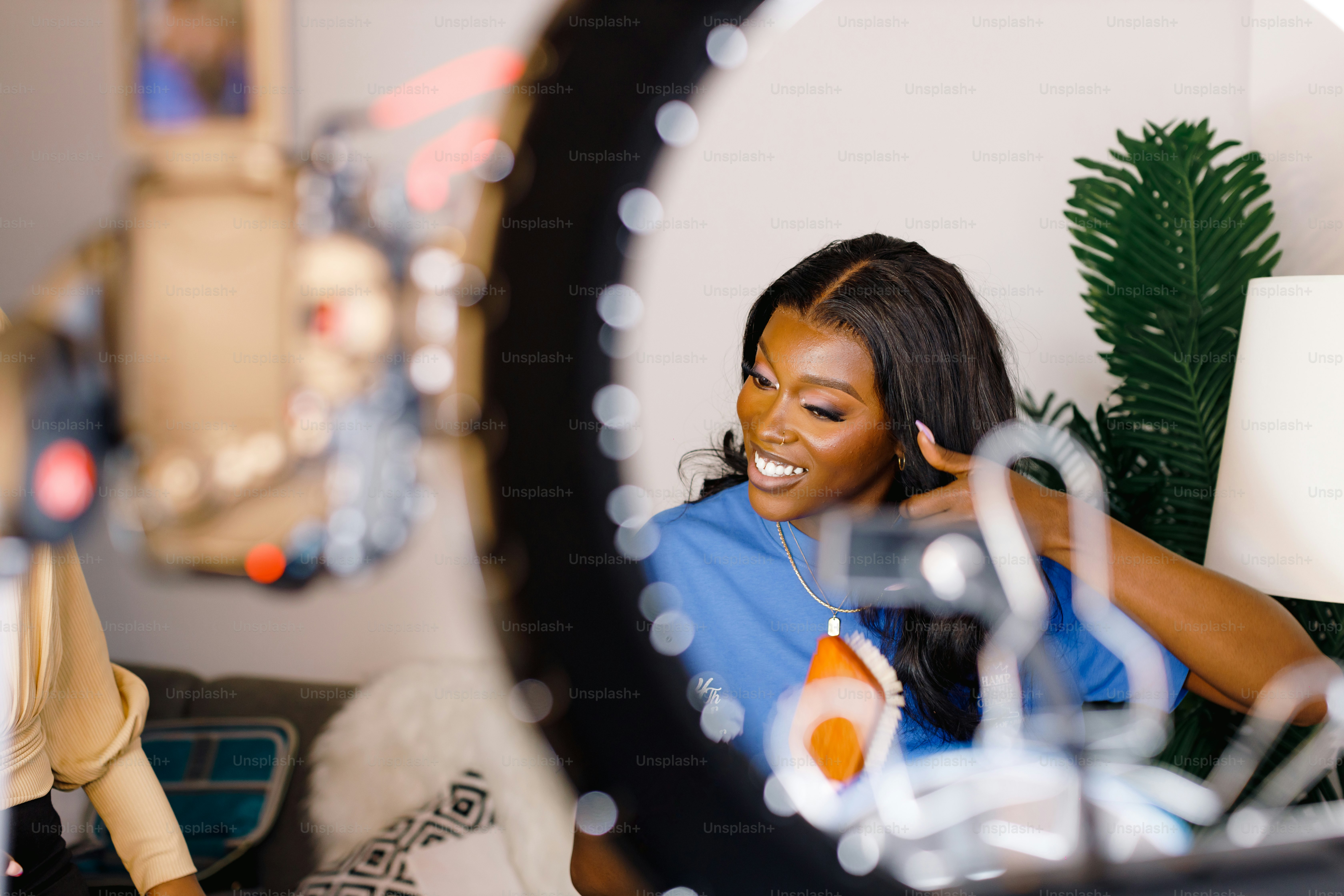 a woman sitting on a couch in front of a mirror