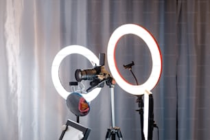 a camera and a light on a tripod