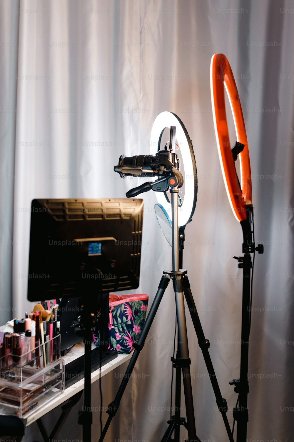 a photo studio with a camera and a tripod