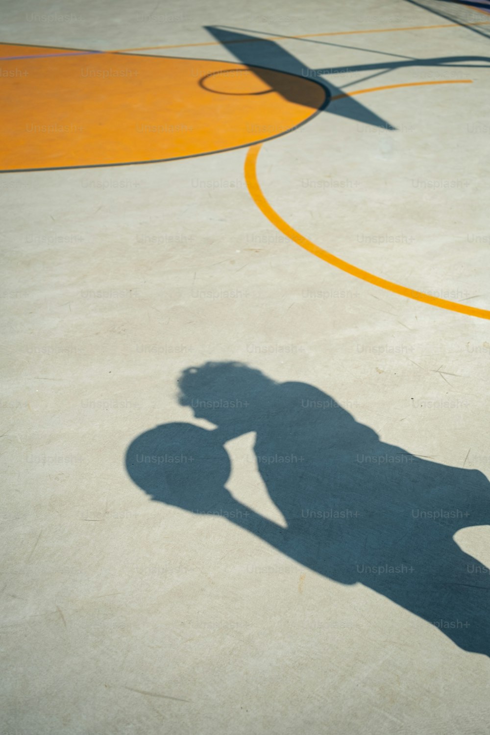 a shadow of a person riding a skateboard