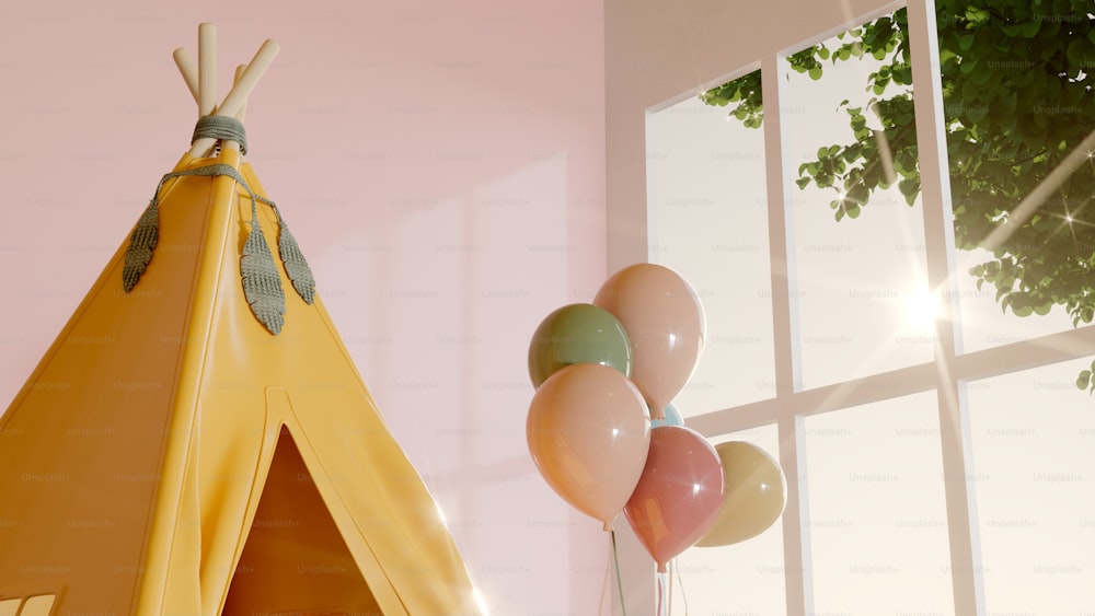 a teepee with balloons in front of a window