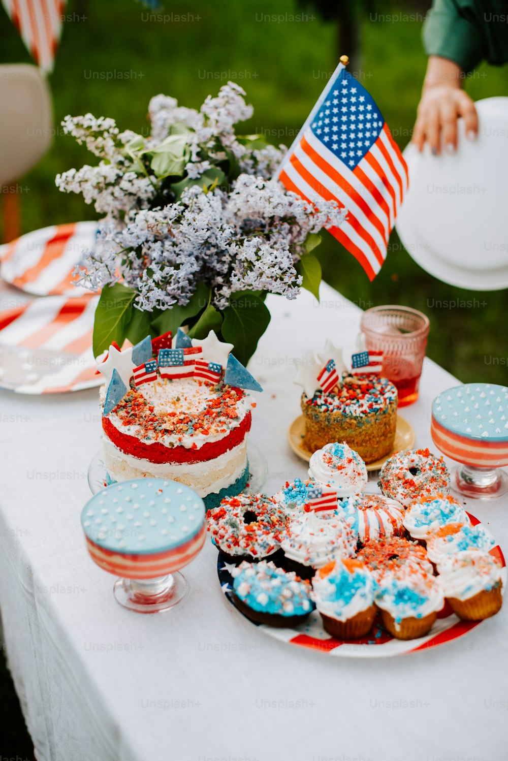 a table topped with lots of cakes and desserts