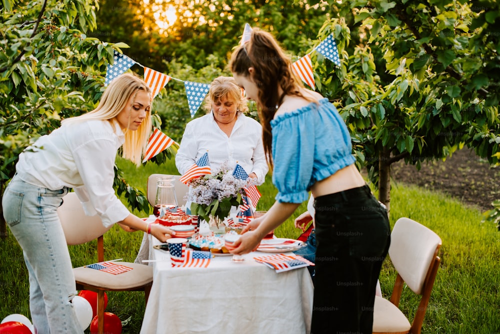 a group of women standing around a table