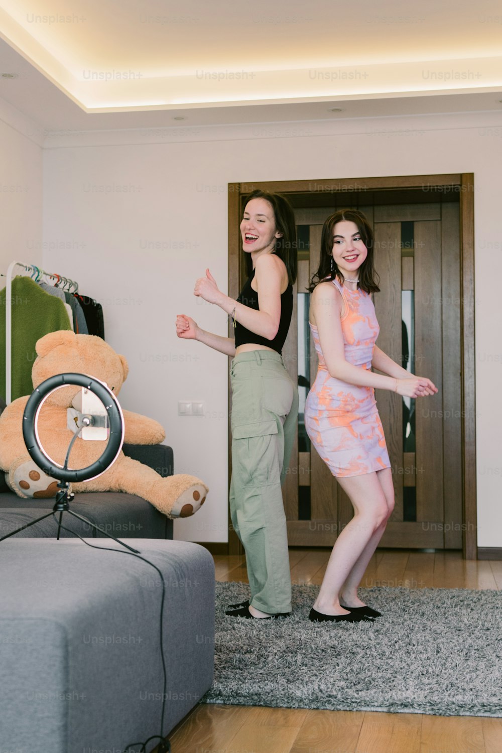 a man and a woman standing in a living room