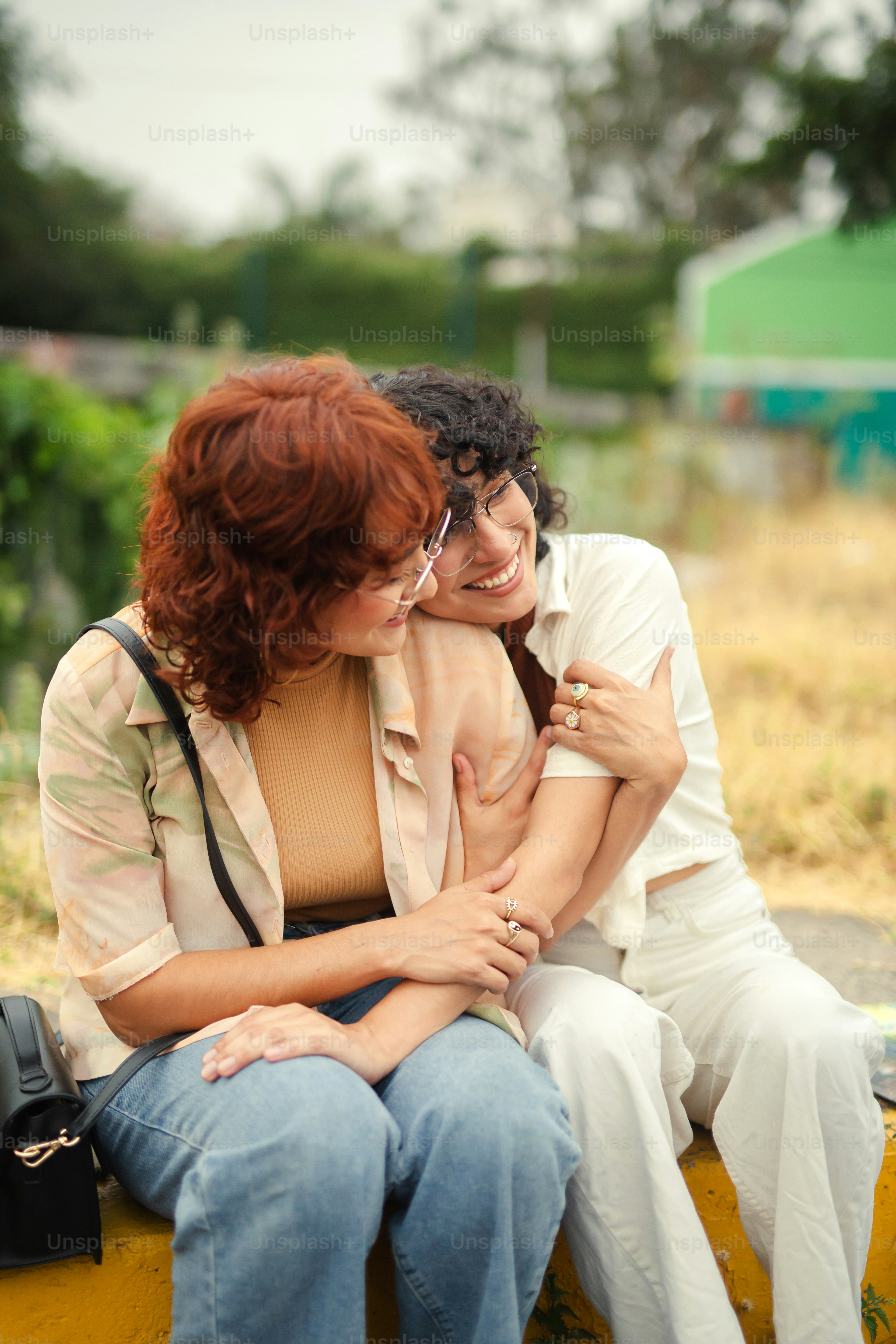 a couple of women sitting next to each other