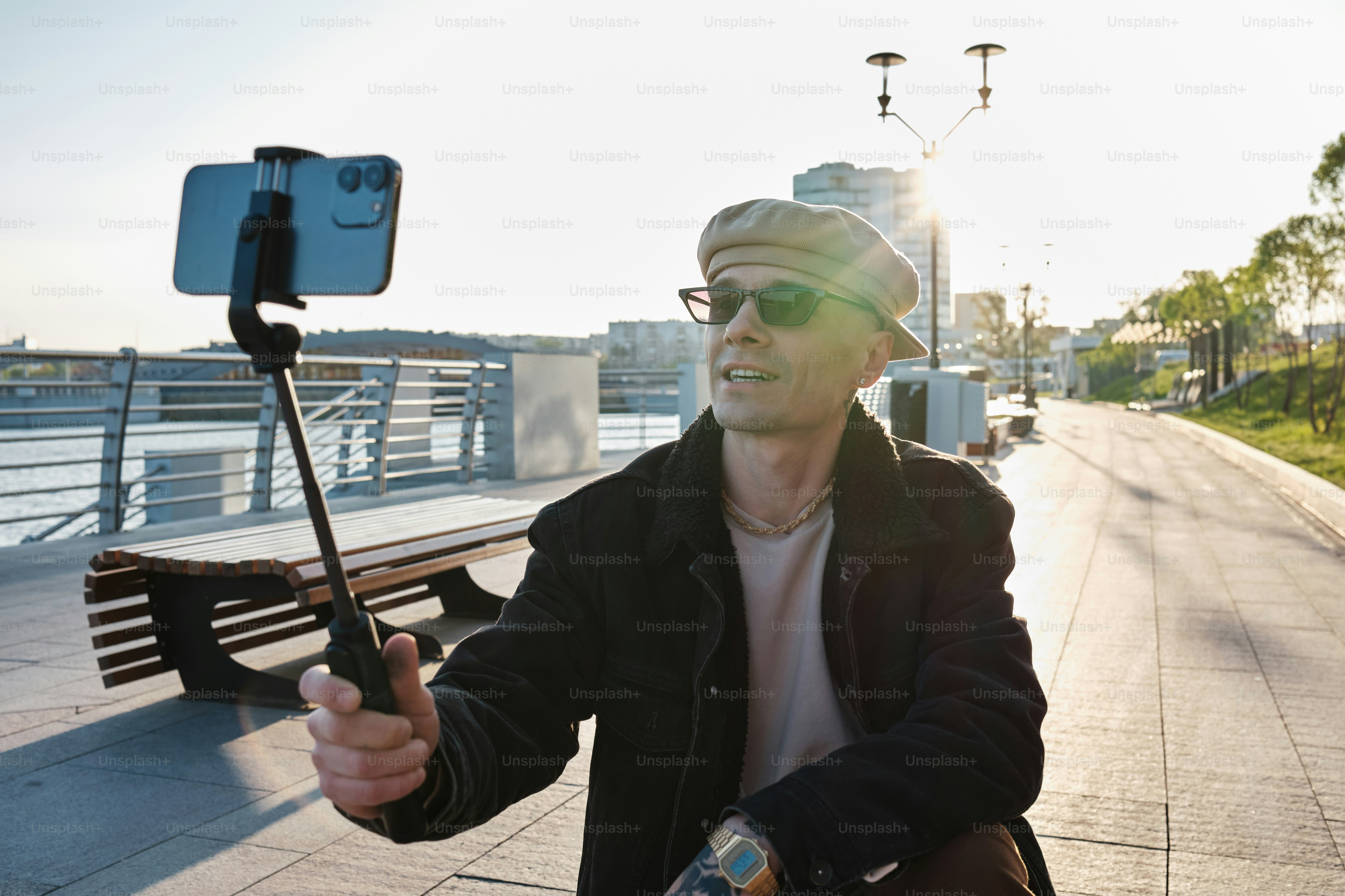 a man taking a picture of himself with his cell phone
