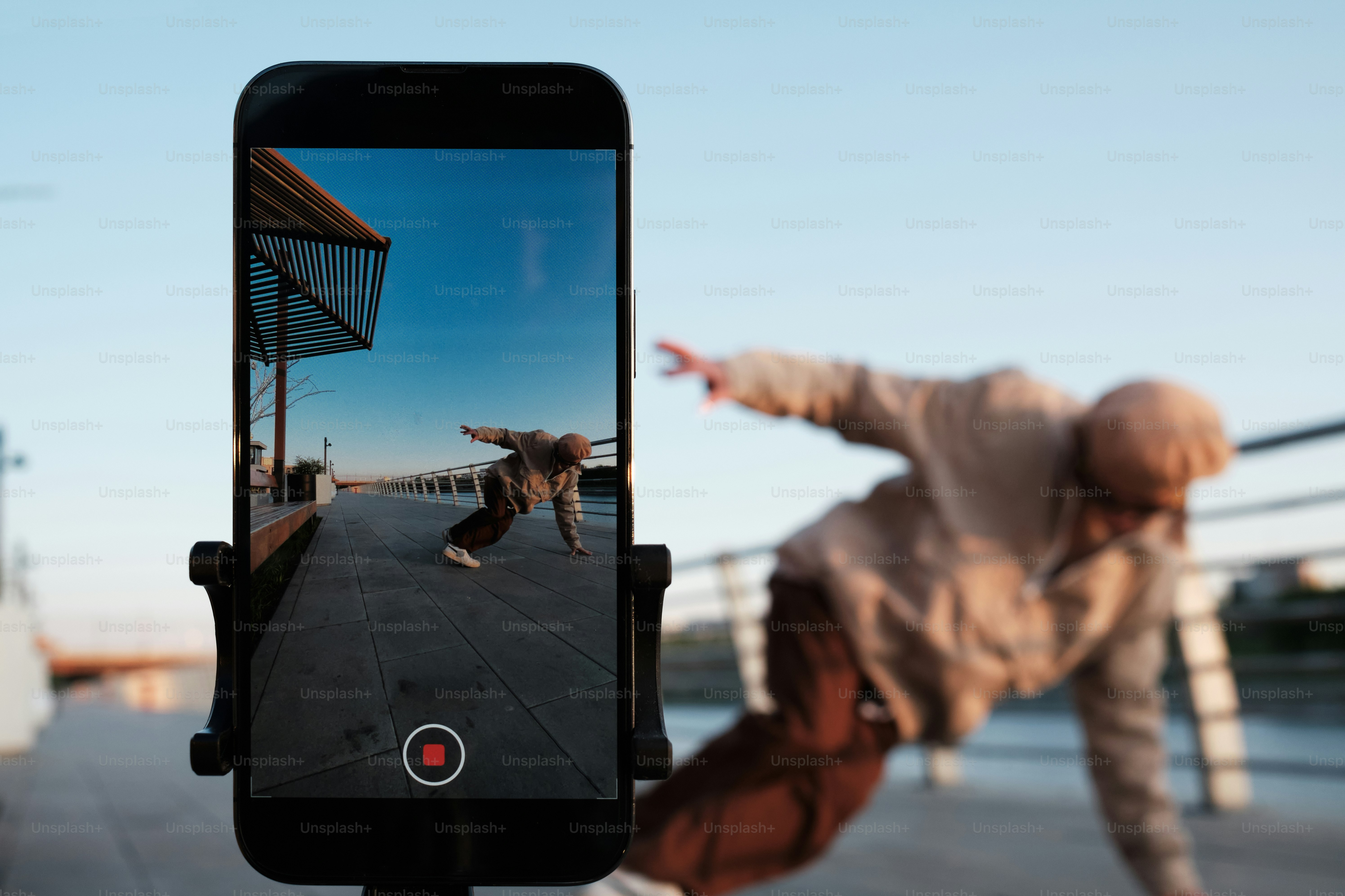 a man doing a trick on a skateboard on a street