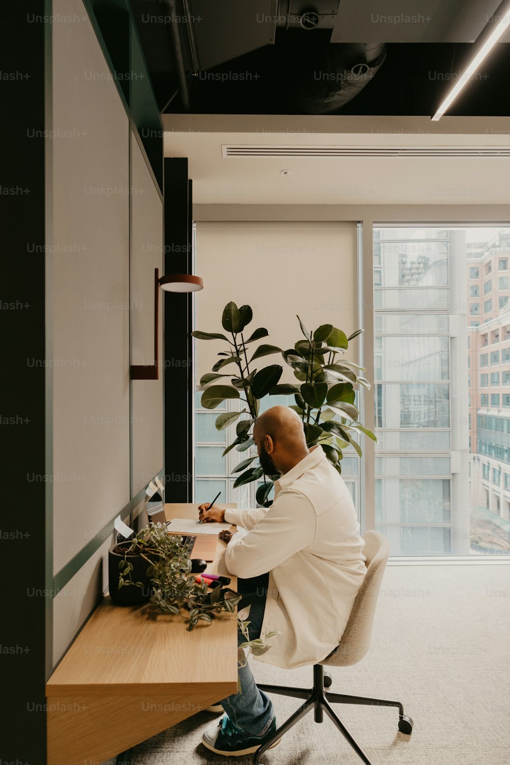 a man sitting at a desk in an office