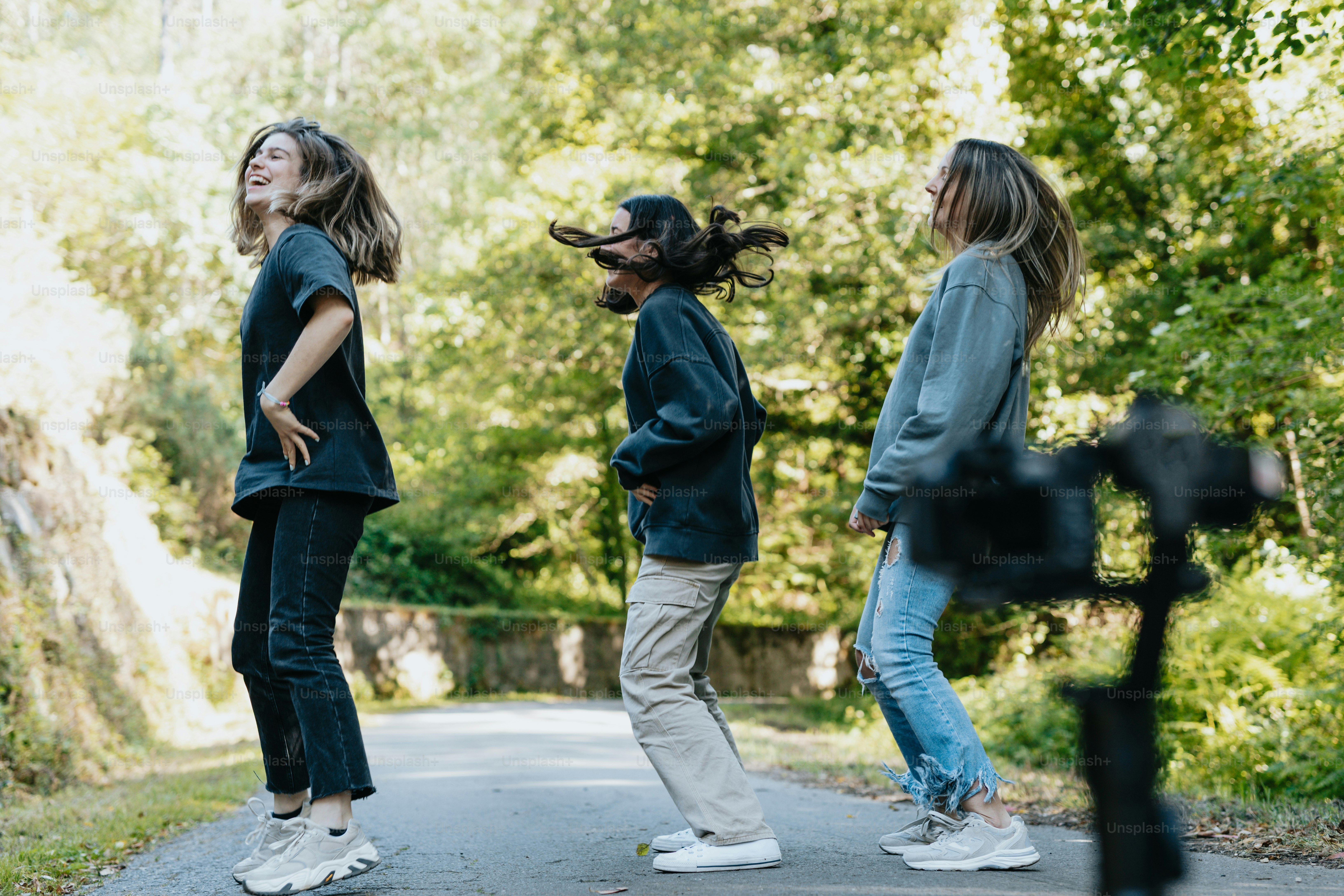 a group of young women standing on a road