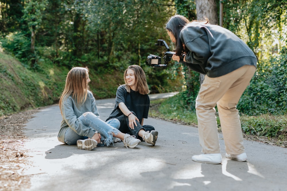 a group of people sitting on a road