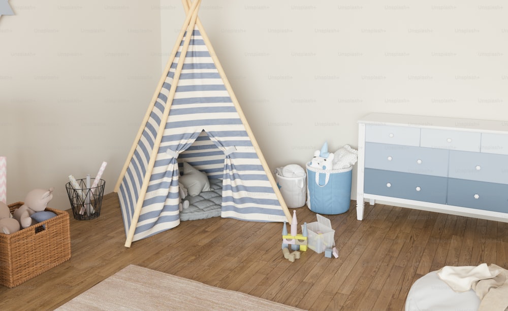 una stanza per bambini con una tenda teepee e giocattoli