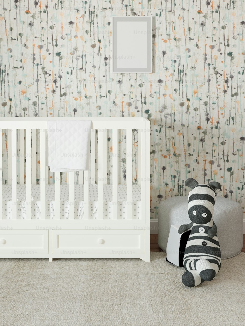 a baby crib with a stuffed animal next to it