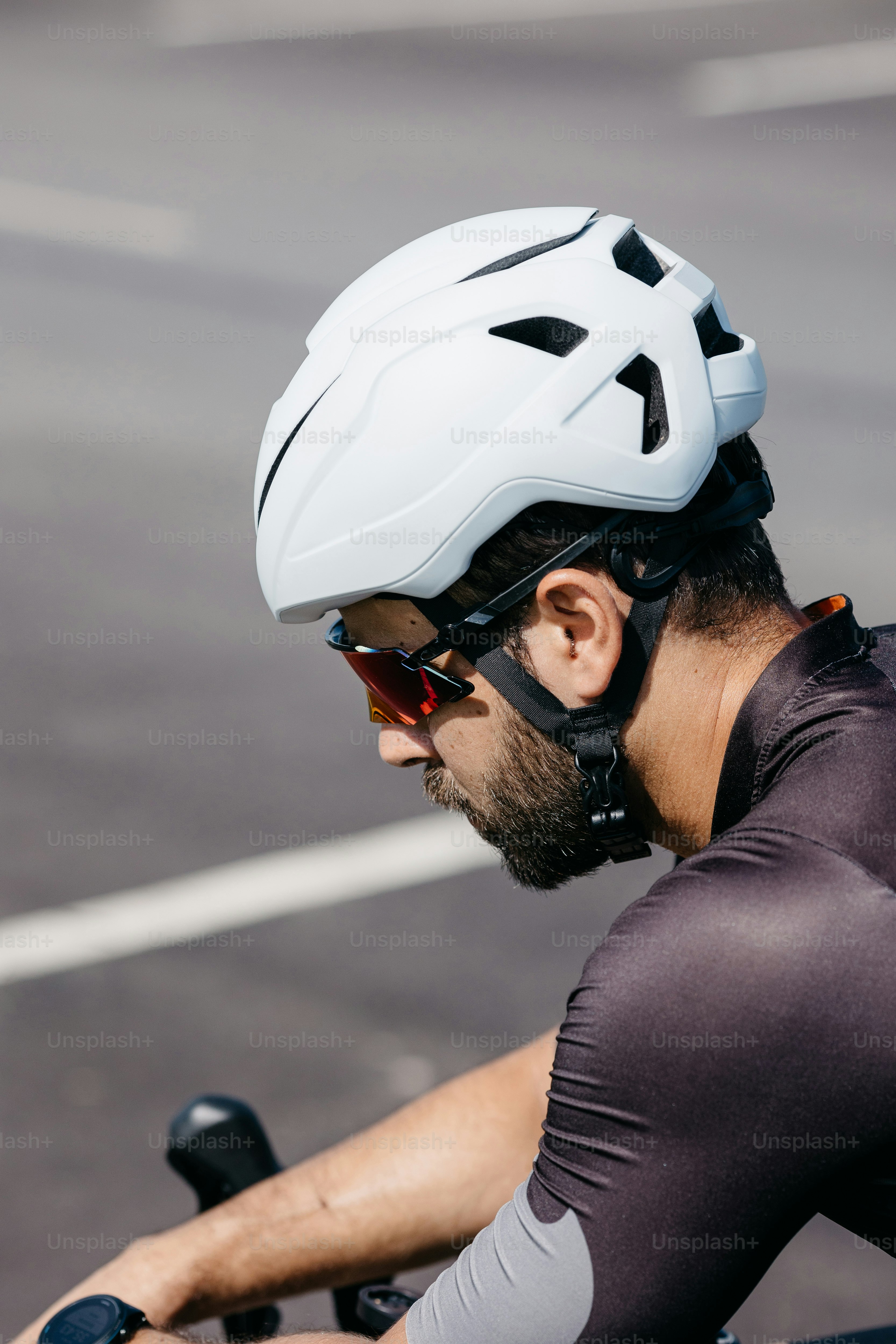 a man wearing a helmet while riding a bike