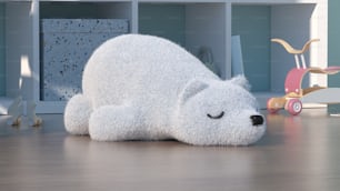 a stuffed polar bear laying on a wooden floor