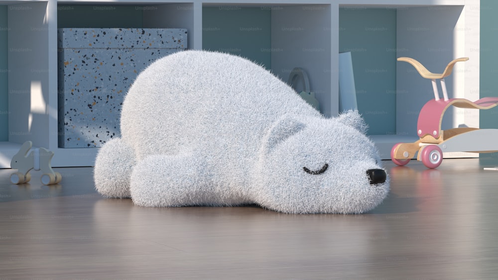 a stuffed polar bear laying on a wooden floor