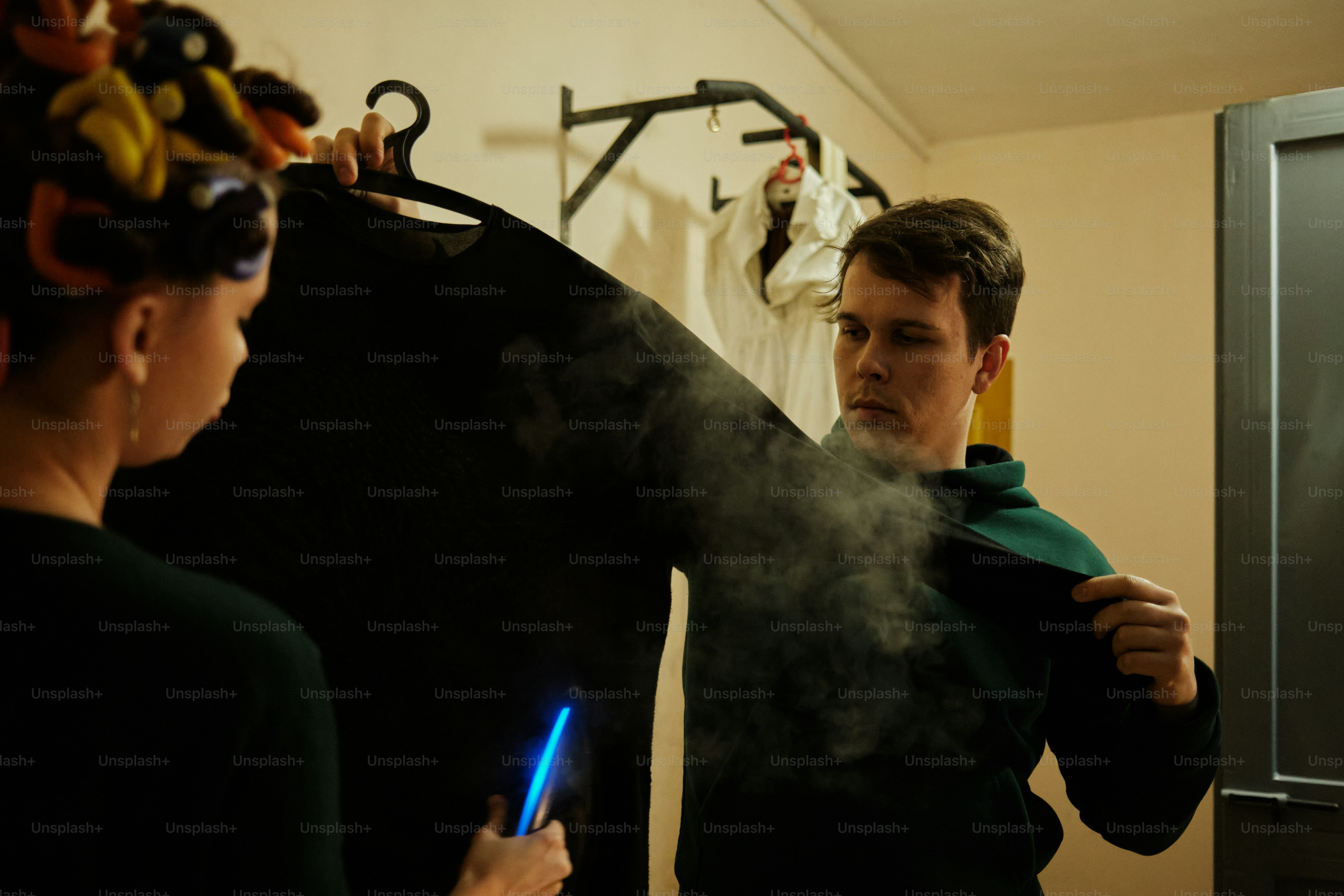 a man and a woman standing in a room