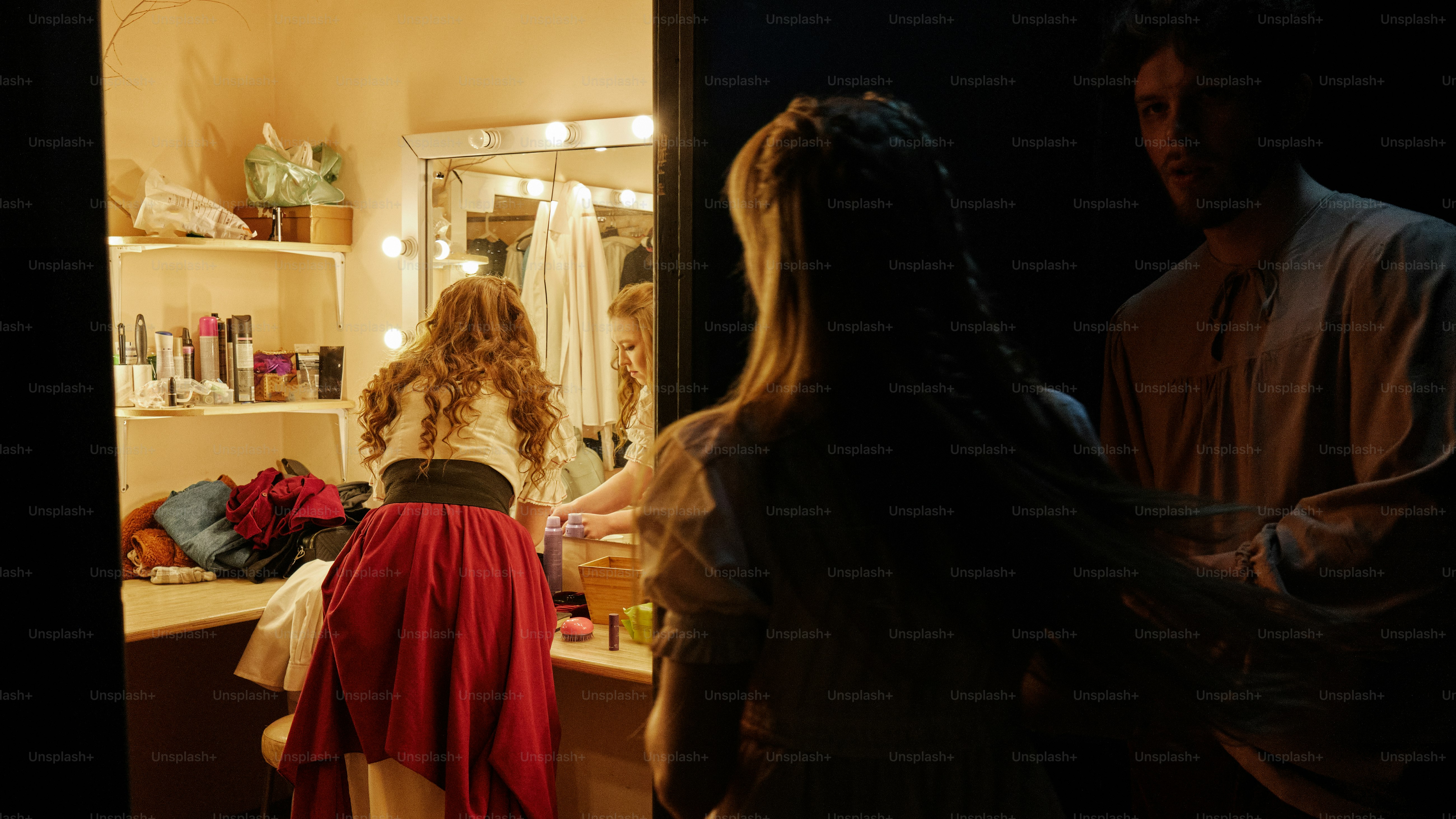 Actors in the dressing room preparing for a performance