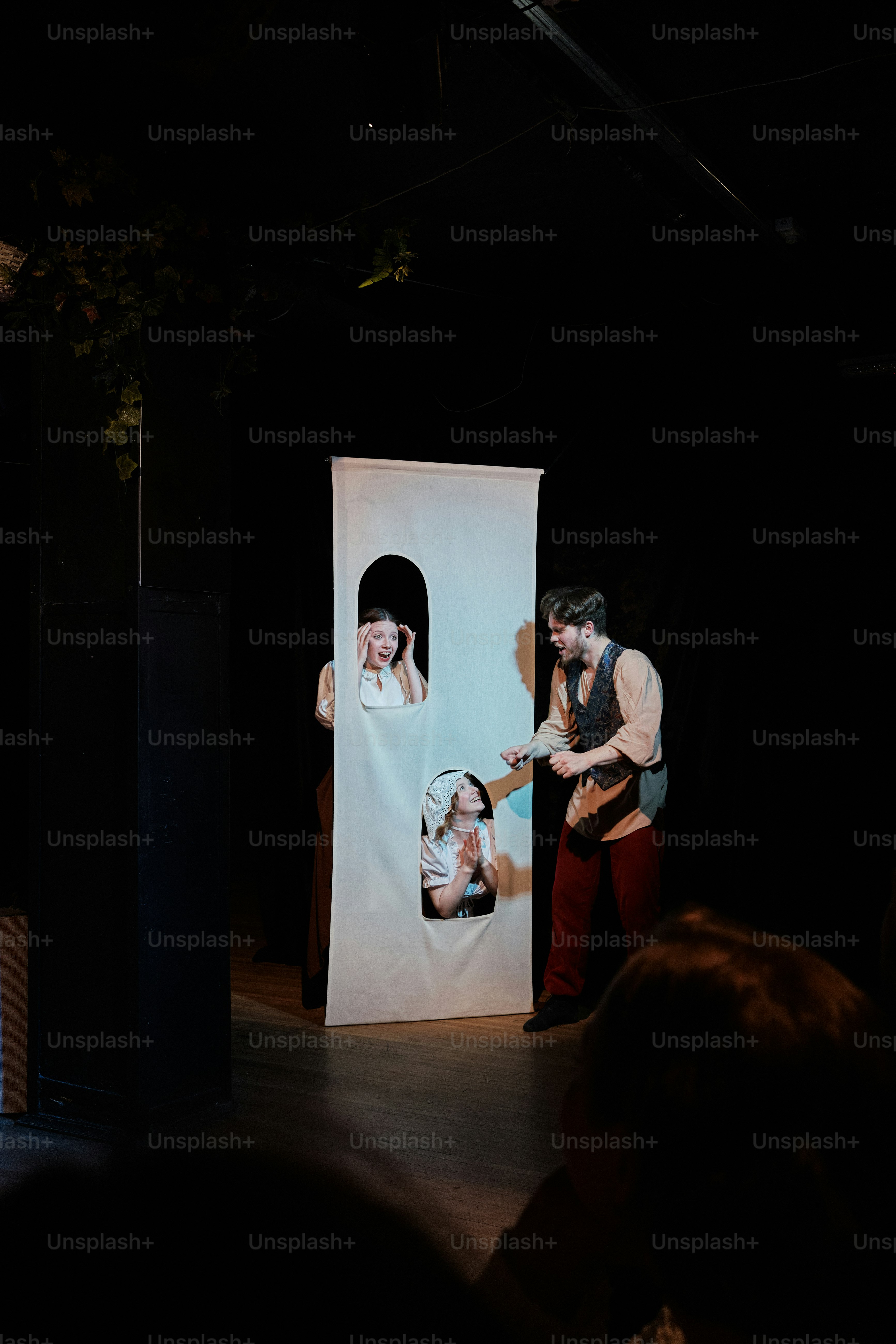 a man standing next to a woman on a stage