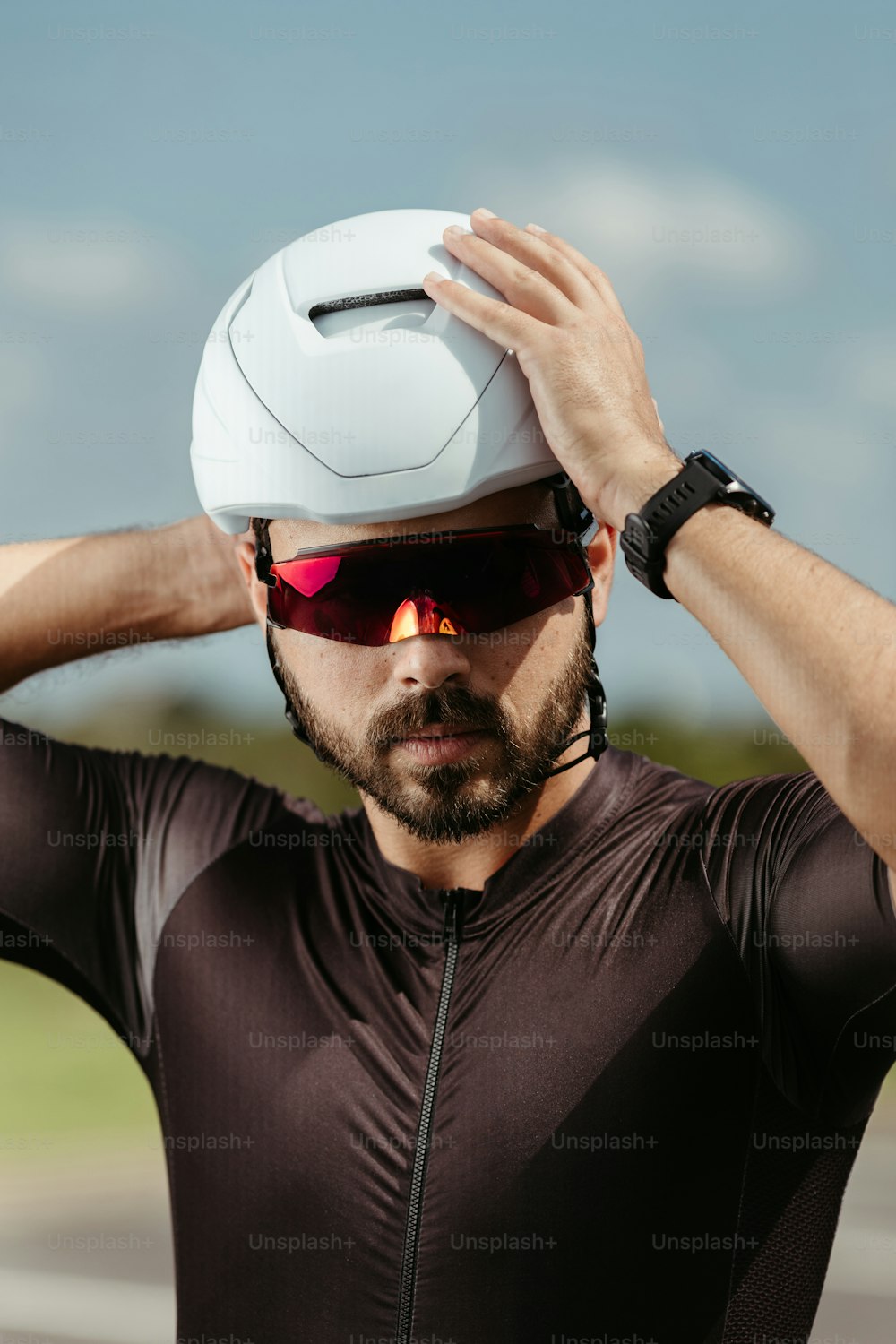 a man with a helmet and sunglasses on his head