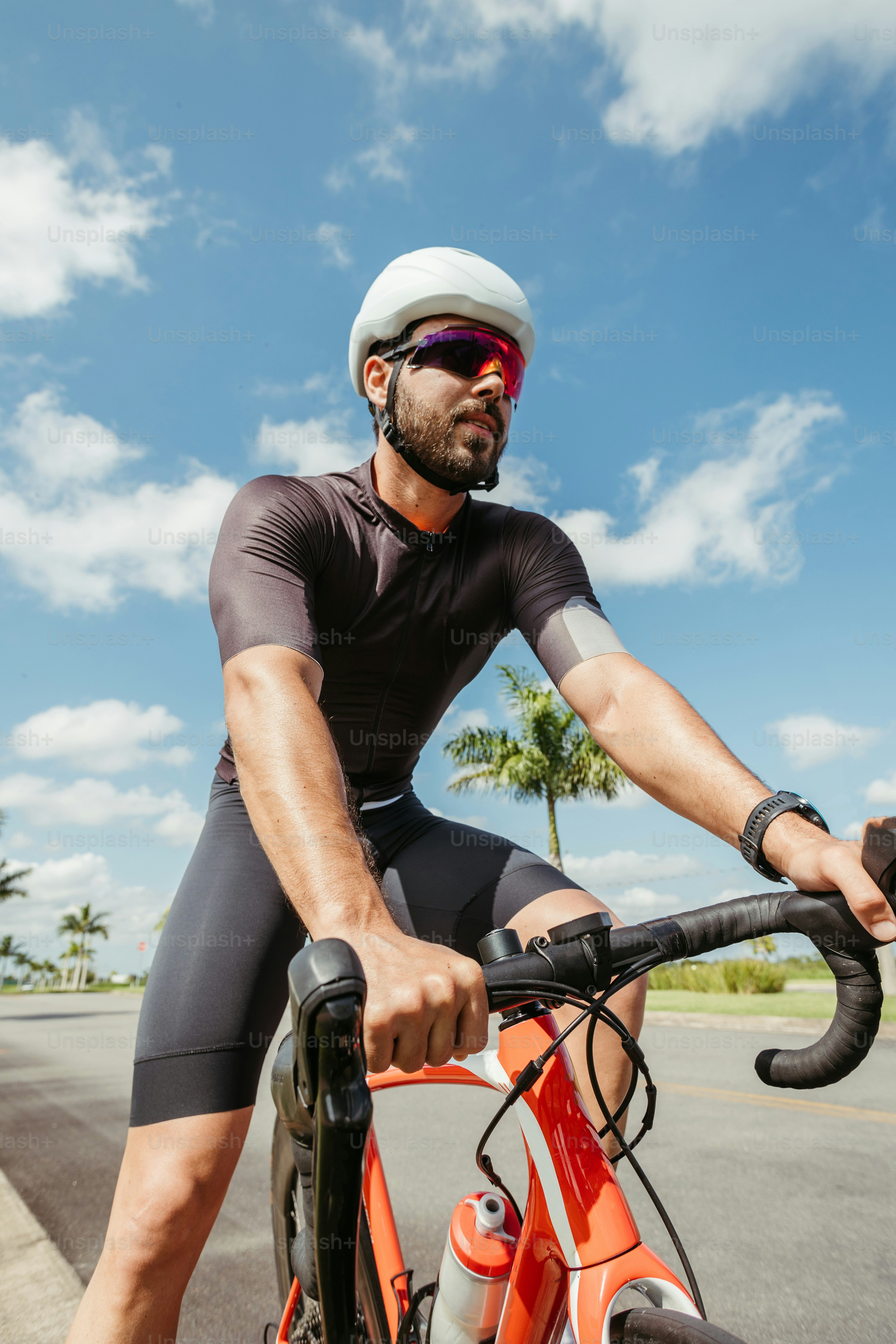 a man riding a bike down a street