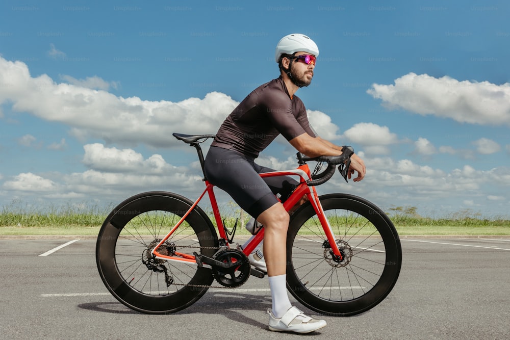 a man riding a bike in a parking lot