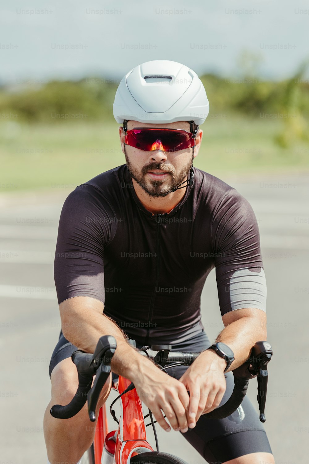 a man riding a bike down a street