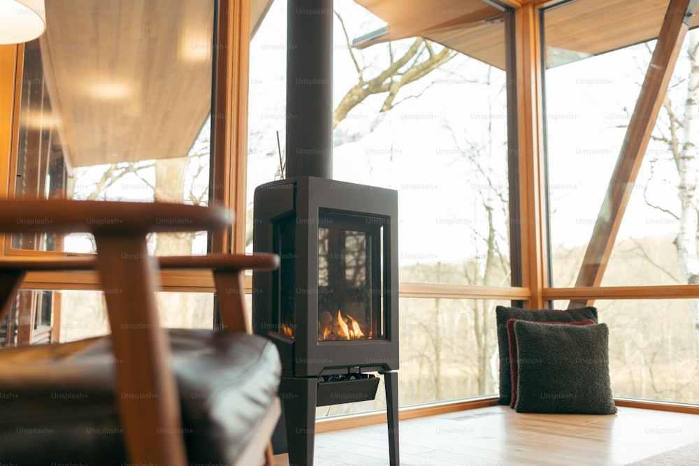a wood burning stove in a living room next to a window