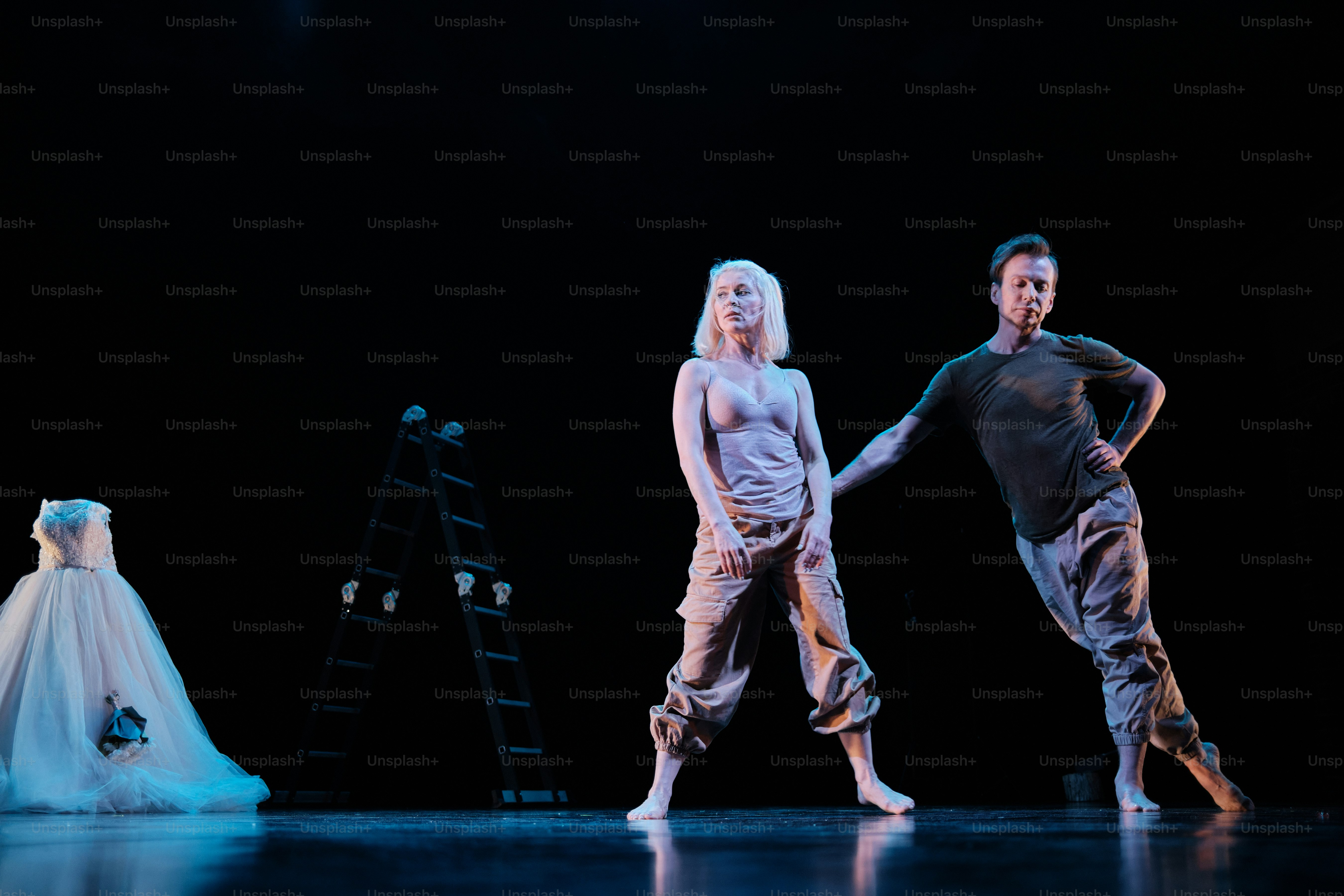 a couple of people that are standing on a stage