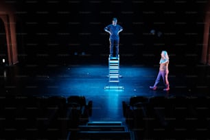 a couple of people standing on top of a stage