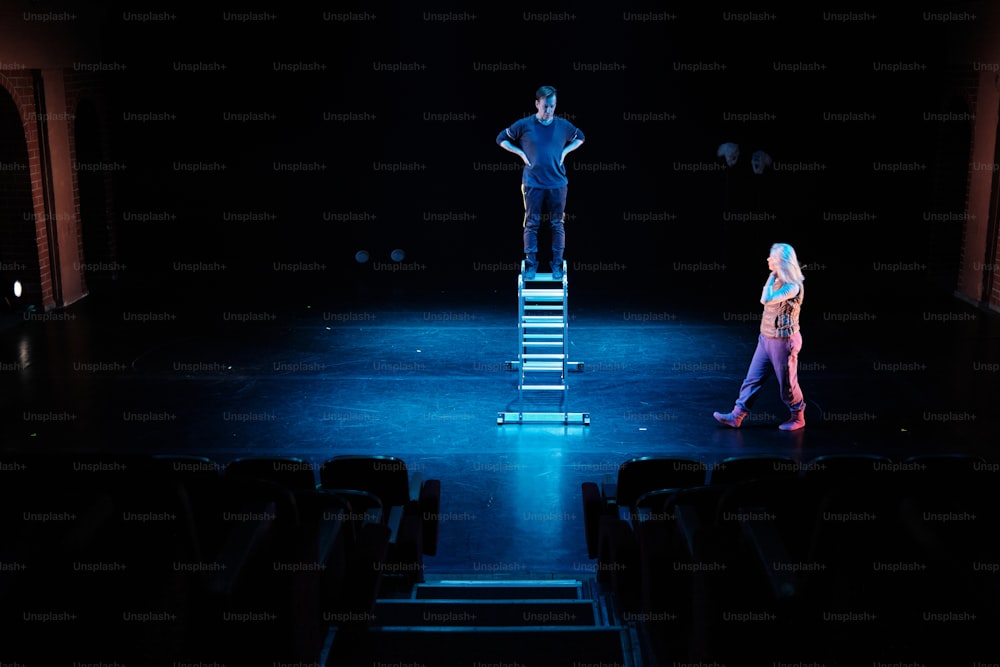 a couple of people standing on top of a stage