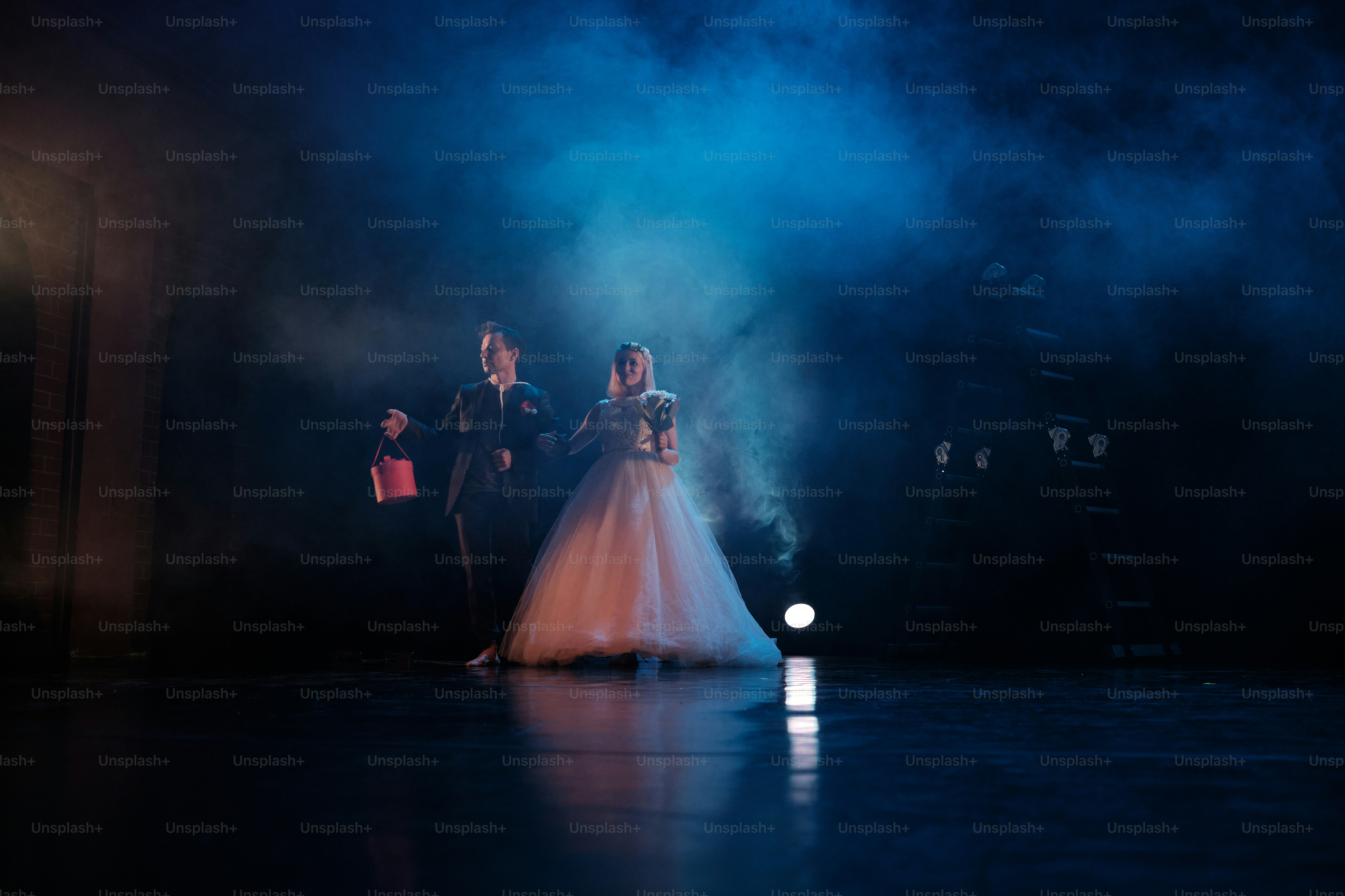 a couple of people that are standing on a stage