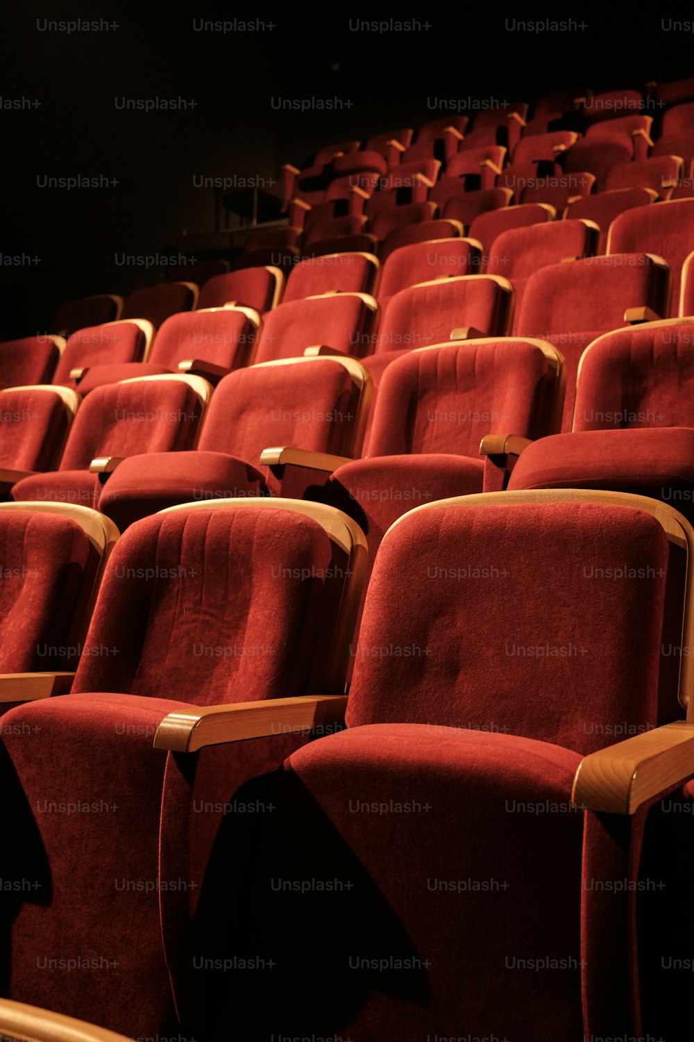 a row of red seats in a theater