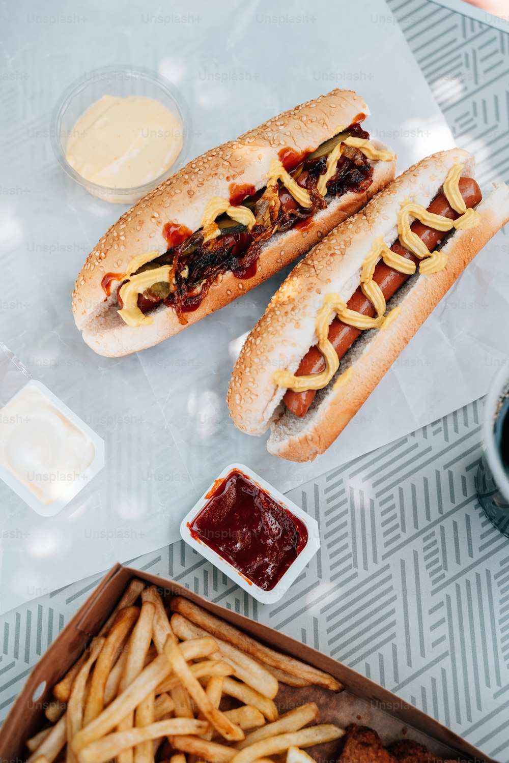 a couple of hot dogs sitting on top of a table