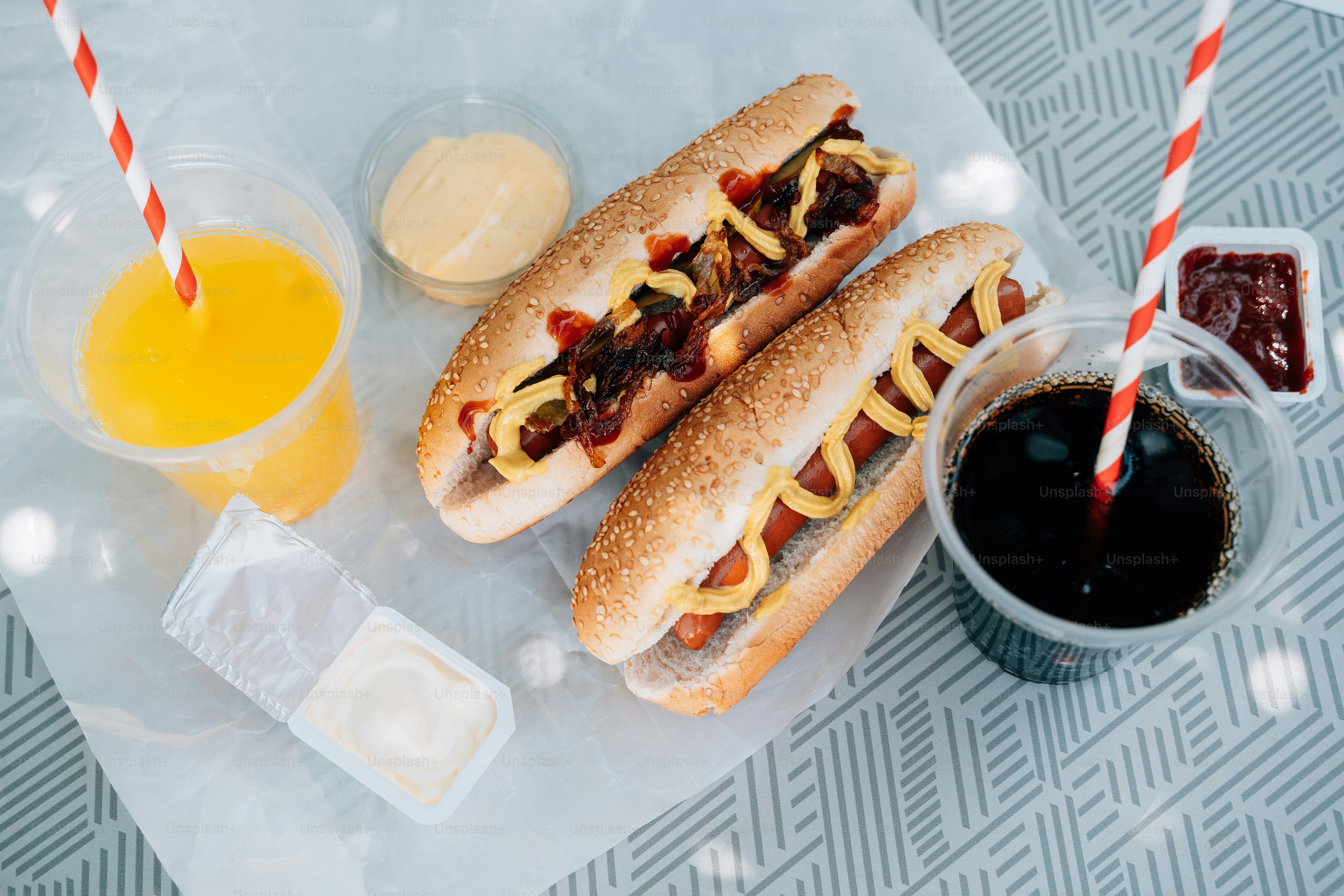 a couple of hot dogs sitting on top of a table