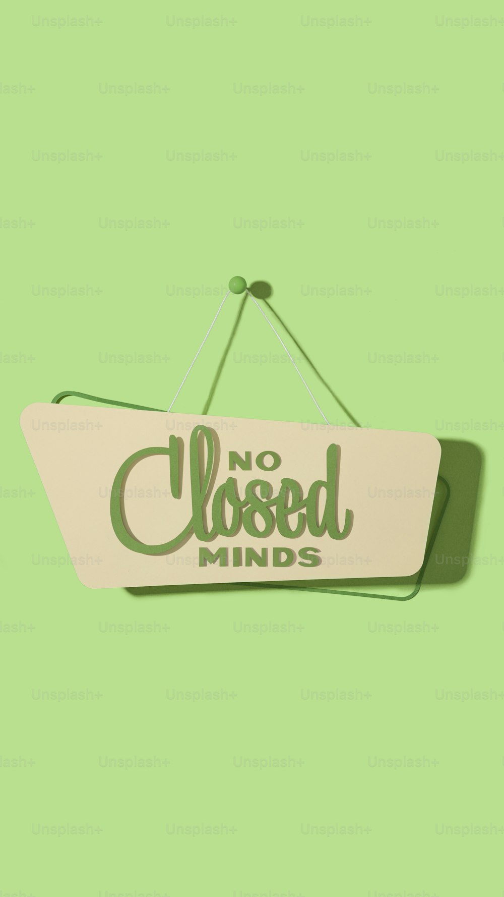 a sign that says no closed minds hanging on a wall