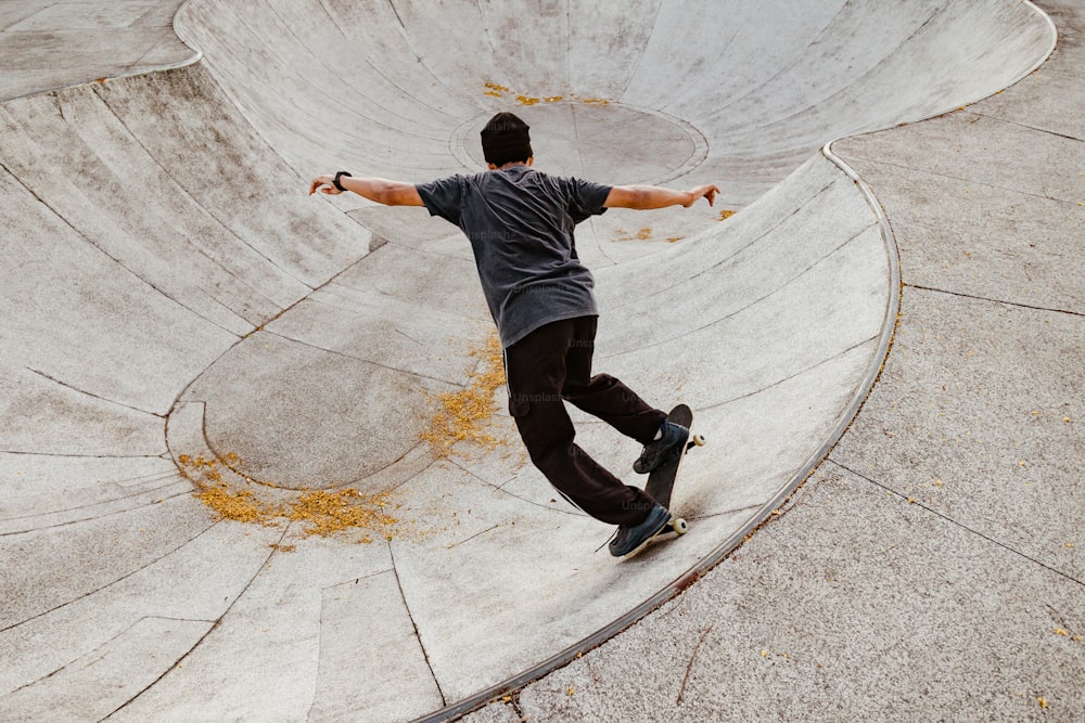 a man riding a skateboard up the side of a ramp