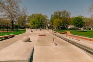 a group of skateboard ramps in a park